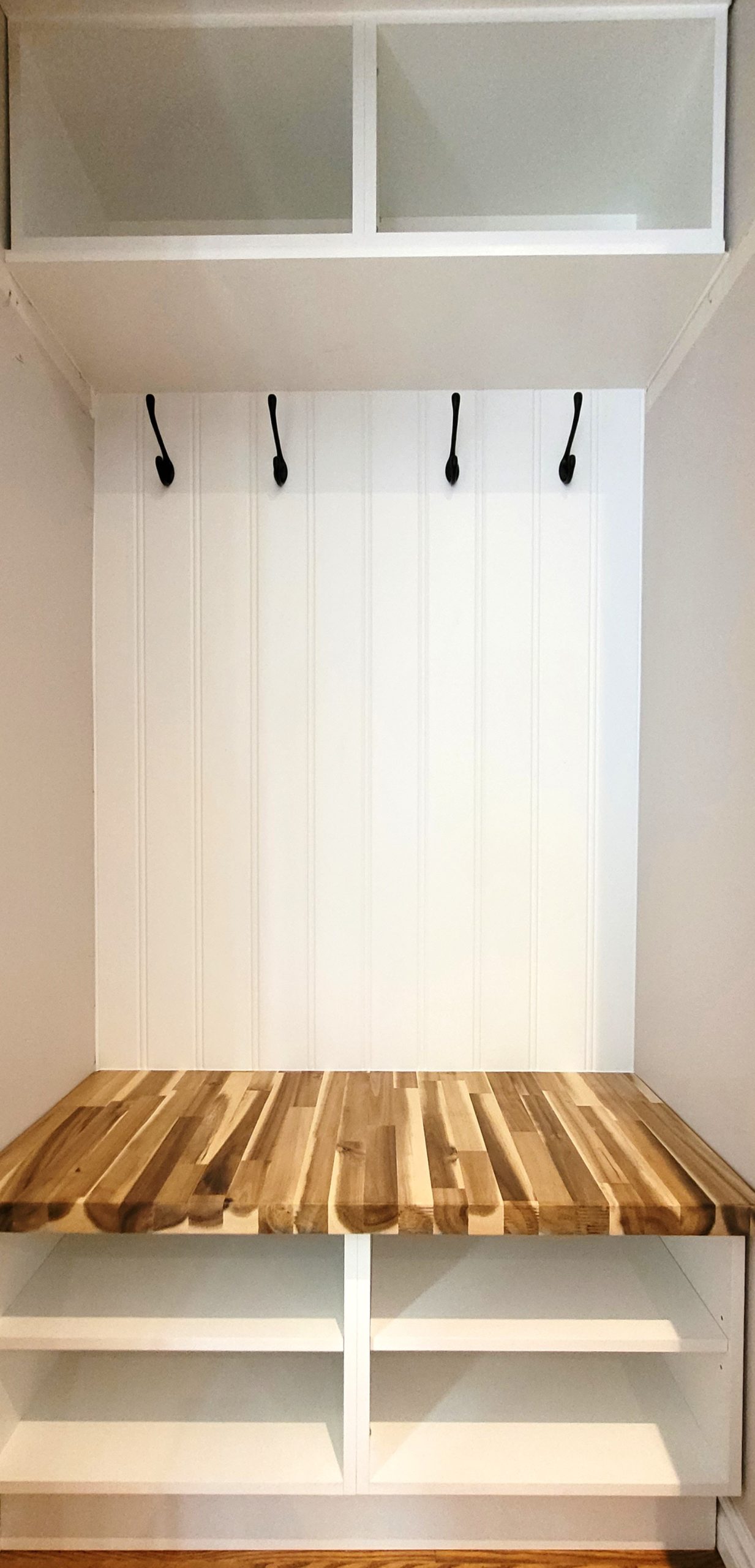 Mudroom with beaded panel and wood top bench