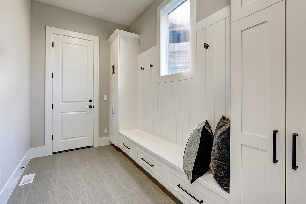Mudroom with Seating, Cabinets, and Coat Hangers
